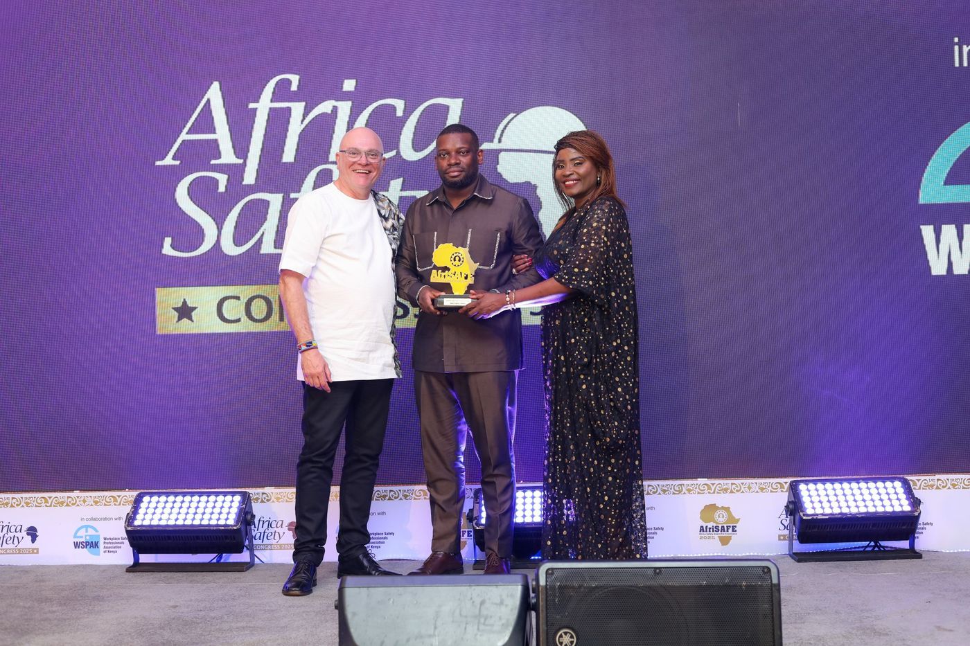 SCL receiving the AfriSAFE award on stage