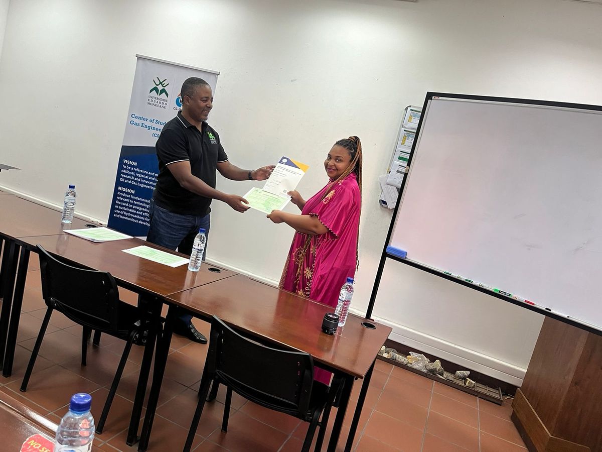 Learner receiving her certificate from an SCL trainer