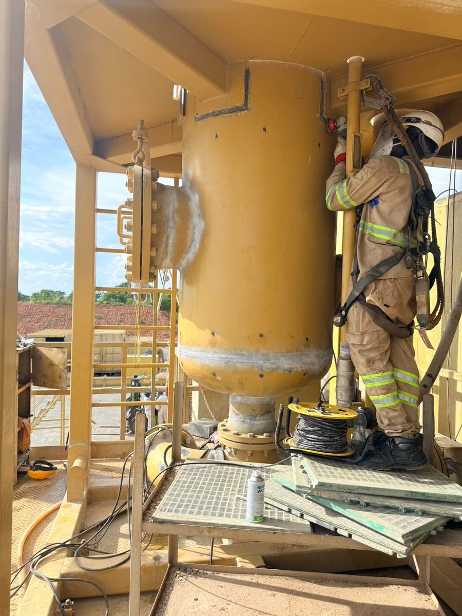 Inspector working on a drilling rig component