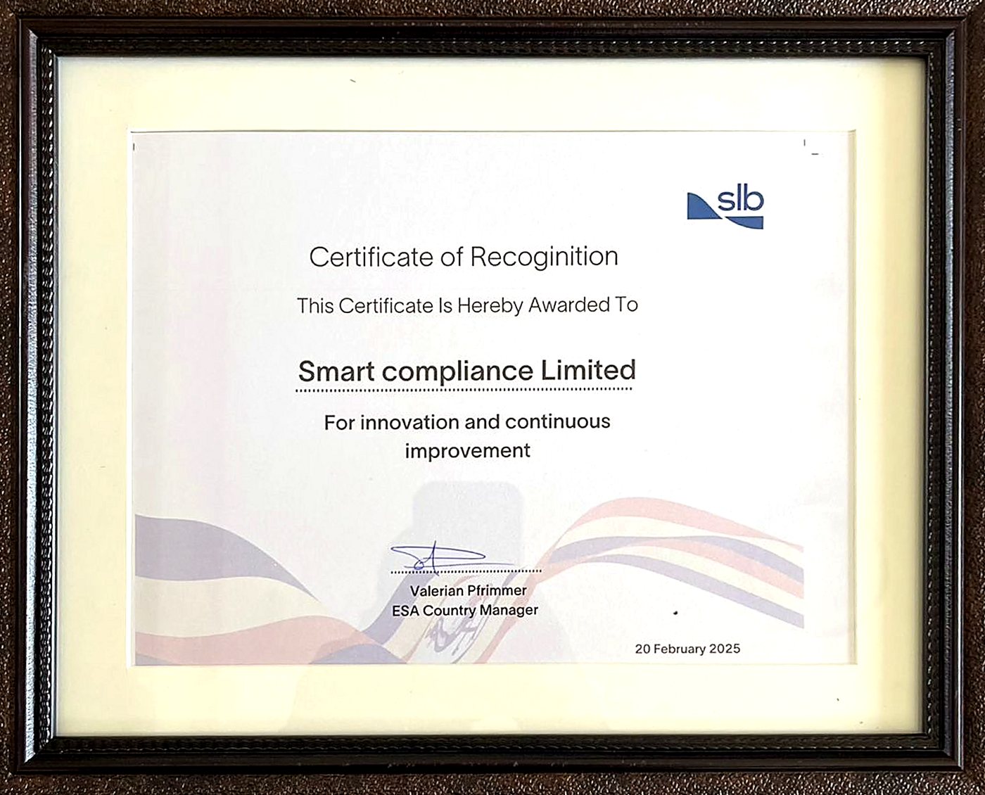 Framed SLB Certificate of Recognition awarded to Smart Compliance Limited for innovation and continuous improvement, 20 February 2025