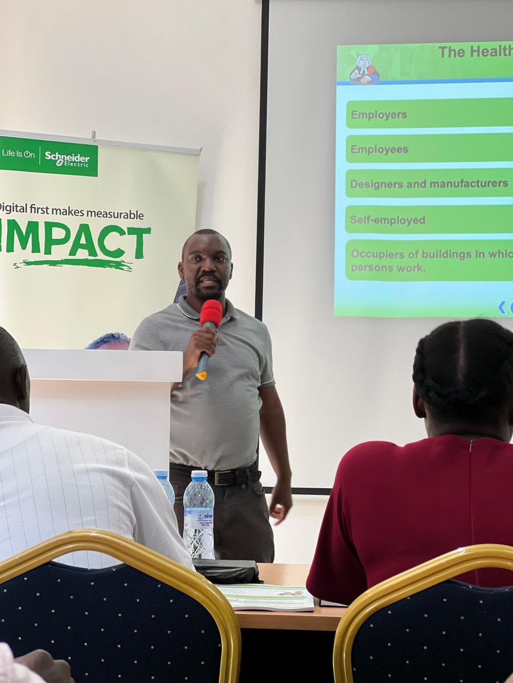 SCL trainer teaching SME participants on a Schneider Electric IMPACT programme